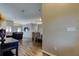 Open-concept living room with modern lighting and stylish furnishings is ideal for entertaining and relaxation at 28826 Windover St, Wesley Chapel, FL 33545