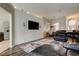 Bright living room features an accent wall and plenty of natural light at 28826 Windover St, Wesley Chapel, FL 33545