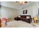 Spacious living room with a comfortable sofa, neutral walls, and a stylish area rug at 28826 Windover St, Wesley Chapel, FL 33545