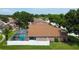 Features a screened-in pool and a fenced backyard, perfect for privacy and relaxation at 28826 Windover St, Wesley Chapel, FL 33545