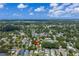 An aerial view of the neighborhood with a vacant lot near a busy street and city skyline at 2910 11Th N St, St Petersburg, FL 33704