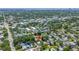 An aerial view of the neighborhood with a vacant lot and nearby businesses at 2910 11Th N St, St Petersburg, FL 33704