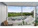 Balcony offers a view of lush greenery, a pool, and parking area, enhancing the outdoor living experience at 3315 58Th S Ave # 311, St Petersburg, FL 33712