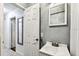 Small bathroom with white tiling, a white basin, and simple fixtures at 3315 58Th S Ave # 311, St Petersburg, FL 33712