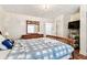 Bedroom features a wooden dresser, a TV, and an open doorway at 3315 58Th S Ave # 311, St Petersburg, FL 33712