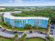 Condominium complex featuring multiple units, parking, and green landscaping at 3315 58Th S Ave # 311, St Petersburg, FL 33712