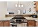 Well-equipped kitchen with stainless steel range, and countertops open to living area at 3315 58Th S Ave # 311, St Petersburg, FL 33712