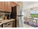 Modern kitchen with stainless steel appliances, dishwasher and eat in kitchen / dining room access at 3315 58Th S Ave # 311, St Petersburg, FL 33712