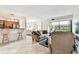 A spacious living room with tile floors, an open floor plan, and large windows providing natural light at 3315 58Th S Ave # 311, St Petersburg, FL 33712