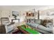 Comfortable living room featuring tile floors, an open floor plan and neutral decor with warm sunlight at 3315 58Th S Ave # 311, St Petersburg, FL 33712