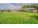 A lush backyard features green grass, a patio, shed, and established landscaping at 3505 Medulla Rd, Plant City, FL 33566
