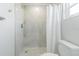 This bathroom offers a stylish, tiled, walk-in shower with modern fixtures and a new toilet at 3505 Medulla Rd, Plant City, FL 33566