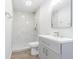 Modern bathroom featuring an updated vanity, mirror, fixtures, and glass enclosed shower with stone flooring at 3505 Medulla Rd, Plant City, FL 33566