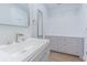 This bathroom features a modern vanity with a stylish sink, mirror, and ample storage in the built-in drawers at 3505 Medulla Rd, Plant City, FL 33566