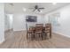 Dining room featuring a wood table with seating for four and a large wall-mounted television at 3505 Medulla Rd, Plant City, FL 33566