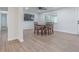 Cozy dining room featuring a wood table with seating for four and stylish modern ceiling fan fixture at 3505 Medulla Rd, Plant City, FL 33566