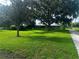 Beautiful single-story home with large oak trees providing shade and curb appeal at 3505 Medulla Rd, Plant City, FL 33566