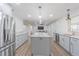 A bright kitchen featuring an island, stainless appliances, modern cabinets, and recessed lighting at 3505 Medulla Rd, Plant City, FL 33566