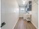 Functional laundry room with updated appliances, storage, and convenient sink for added utility at 3505 Medulla Rd, Plant City, FL 33566