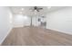 Spacious living room features hardwood floors, ceiling fan, recessed lighting, and an open floor plan at 3505 Medulla Rd, Plant City, FL 33566