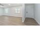 This bright living room has wood flooring, a front door, and a window at 3505 Medulla Rd, Plant City, FL 33566