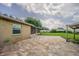 Paver patio outside a brick home, leading to a screened porch and offering outdoor living space at 3505 Medulla Rd, Plant City, FL 33566