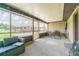 Large screened patio featuring an outdoor seating area and an outdoor dining area at 3505 Medulla Rd, Plant City, FL 33566