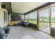 This screened-in patio features a comfortable seating area and a view of the backyard at 3505 Medulla Rd, Plant City, FL 33566
