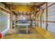A spacious shed interior with work tables and ample storage, illuminated by bright overhead lighting at 3505 Medulla Rd, Plant City, FL 33566