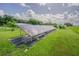 This house features solar panels on a manicured lawn at 3505 Medulla Rd, Plant City, FL 33566