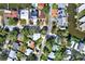 Overhead aerial shot showcases the charming home and sunny neighborhood, conveniently located on a quiet street at 4173 85Th N St, St Petersburg, FL 33709