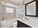 Bathroom featuring a vanity, toilet, tub and decorative accents at 4173 85Th N St, St Petersburg, FL 33709