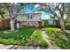 Charming two-story home with brick and siding exterior and lush landscaping at 4173 85Th N St, St Petersburg, FL 33709