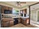 Kitchen with custom cabinets, granite countertops, and tile flooring at 4173 85Th N St, St Petersburg, FL 33709