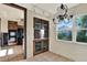 Eat-in kitchen with tile floors, wood cabinets, and a modern chandelier at 4173 85Th N St, St Petersburg, FL 33709