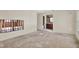 Room showcasing exposed wall and a doorway leading to a full bathroom with classic wooden vanity at 4173 85Th N St, St Petersburg, FL 33709