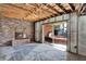 Indoor room showing a brick fireplace and sliding glass doors leading to the outside at 4173 85Th N St, St Petersburg, FL 33709