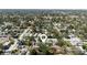 Aerial shot of a house surrounded by lush greenery, with a pool and orderly neighborhood streets at 4637 4Th N Ave, St Petersburg, FL 33713