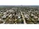Aerial view of a home in a lush neighborhood with trees, streets and the city skyline visible in the distance at 4637 4Th N Ave, St Petersburg, FL 33713