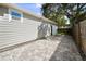 Paved side patio leading to backyard featuring privacy fence and gate at 4637 4Th N Ave, St Petersburg, FL 33713
