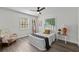 Bright bedroom with windows, ceiling fan and chair at 4637 4Th N Ave, St Petersburg, FL 33713