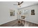 Charming office space featuring a ceiling fan, two windows allowing natural light and luxury vinyl plank flooring at 4637 4Th N Ave, St Petersburg, FL 33713