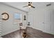 This office space has wood floors, a ceiling fan, natural light, and a dedicated closet for storage at 4637 4Th N Ave, St Petersburg, FL 33713