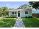 Charming single-story home with a well-manicured lawn and inviting front porch at 4637 4Th N Ave, St Petersburg, FL 33713
