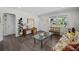 Bright living room with hardwood floors, large windows, and a comfortable seating area at 4637 4Th N Ave, St Petersburg, FL 33713