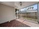 Relaxing screened-in patio featuring wood deck-style flooring, ceiling fan, and privacy screens at 4637 4Th N Ave, St Petersburg, FL 33713