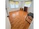 Bright bedroom featuring wood laminate floors, natural light, and versatile space for furnishings to suit your needs at 4851 W Gandy Blvd # B7L36, Tampa, FL 33611
