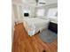 Relaxing bedroom featuring wood laminate floors, built in storage, and natural light, creating a peaceful retreat at 4851 W Gandy Blvd # B7L36, Tampa, FL 33611
