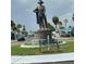 Community monument with statue, bench seating, palm trees and well maintained streets near the property at 4851 W Gandy Blvd # B7L36, Tampa, FL 33611