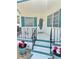 Inviting front entrance featuring freshly painted stairs, black railings, a decorative wreath, and colorful landscaping at 4851 W Gandy Blvd # B7L36, Tampa, FL 33611
